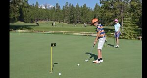 Young people putting.
