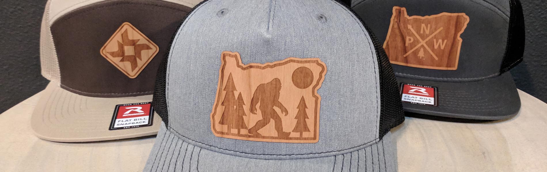 Three baseball caps with Black Butte Ranch graphics.