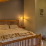 Lodge Room 030 -Bedroom with wooden furniture