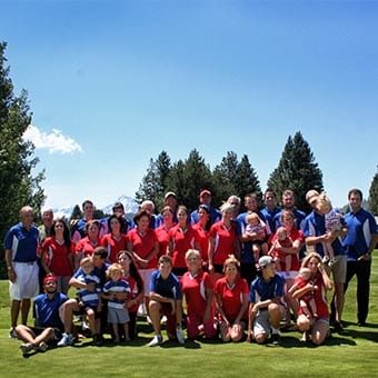 Ensign Reunion group photo on golf course.