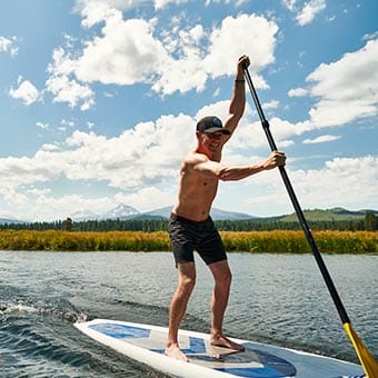Man on standup paddleboard.