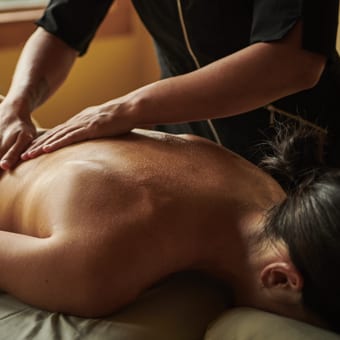 Woman receiving a professional back massage.