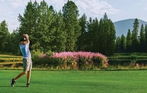 A photo of a man golfing at a golf course in Central Oregon.