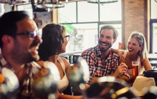 A photo of a group enjoying beers at one of the various Bend breweries.