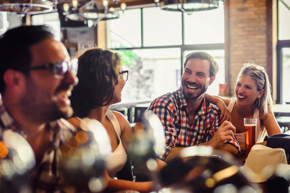 A photo of a group enjoying beers at one of the various Bend breweries.