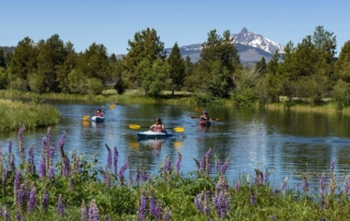 A family kayaking during their Oregon spring break vacation.