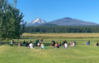 A group doing yoga on an Oregon wellness retreat.