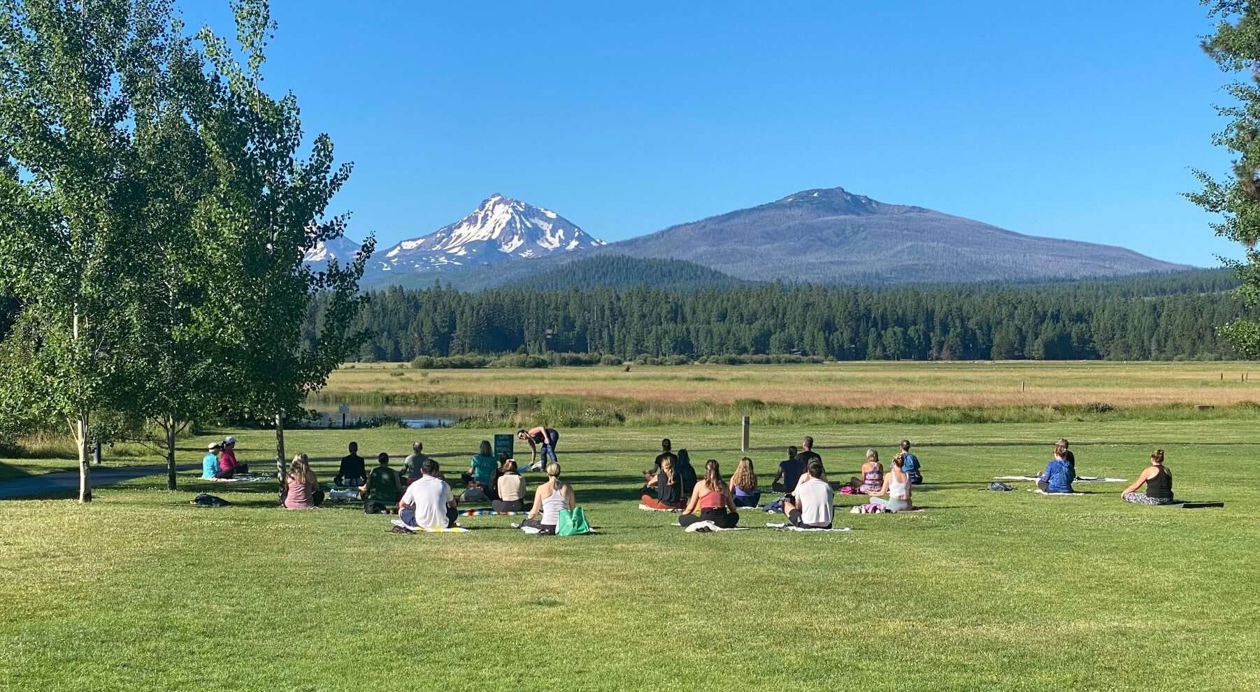 A group doing yoga on an Oregon wellness retreat.