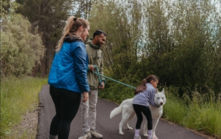 A family out hiking with their dog, one of the many things to do in Oregon with kids.