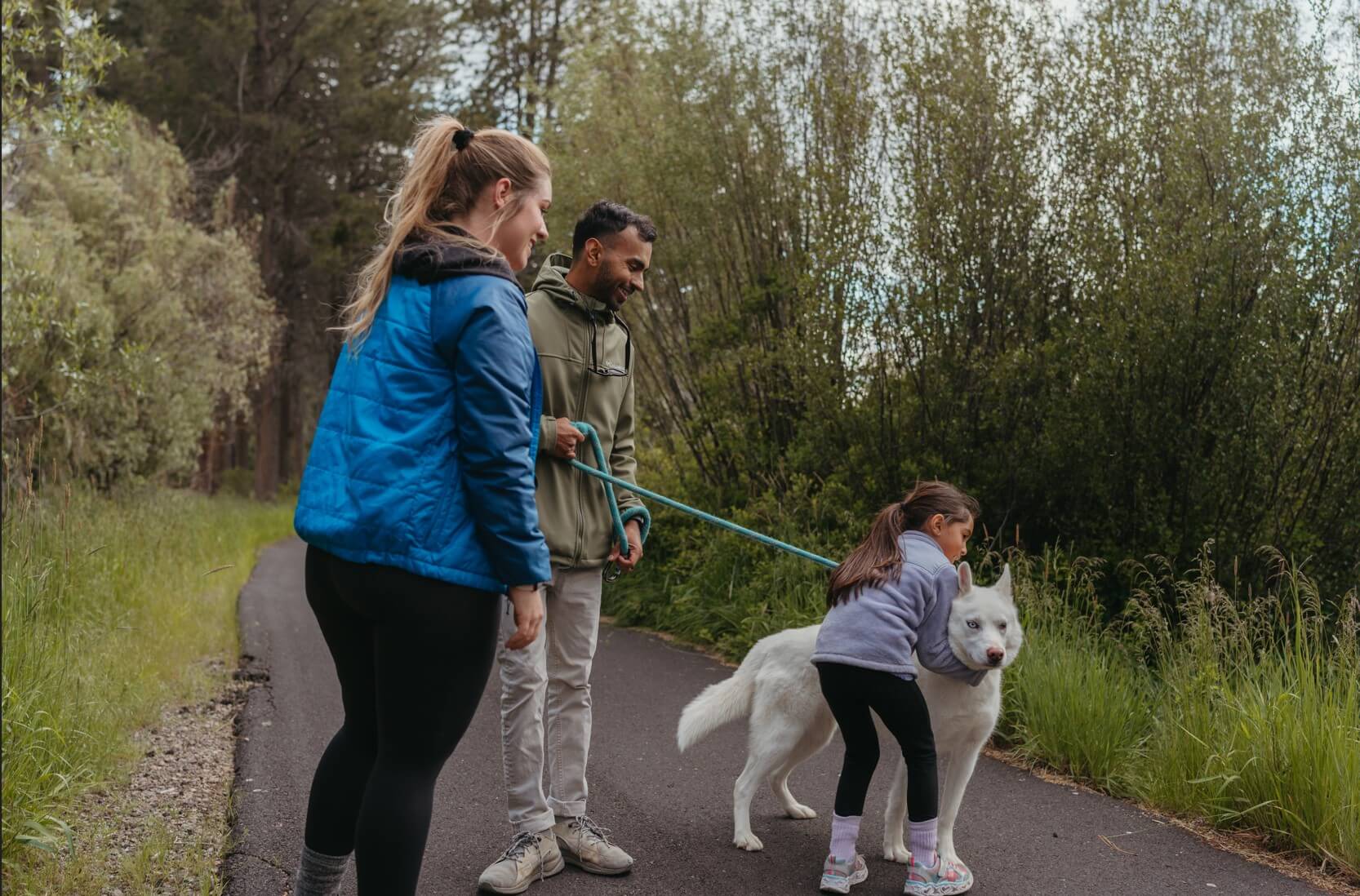 A family out hiking with their dog, one of the many things to do in Oregon with kids.