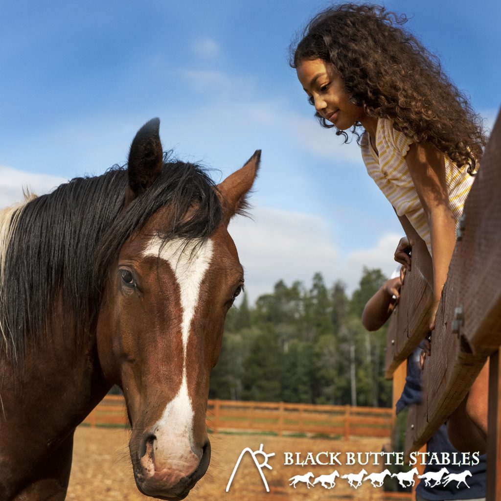 woman with a horse. Text: Black Butte Ranch Stables