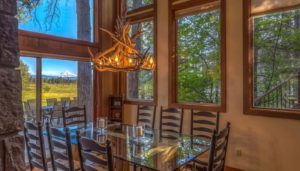 The dining room of an Oregon vacation rental to eat a meal in after whitewater rafting.