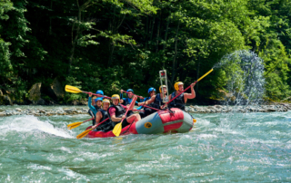A group whitewater rafting in Oregon.