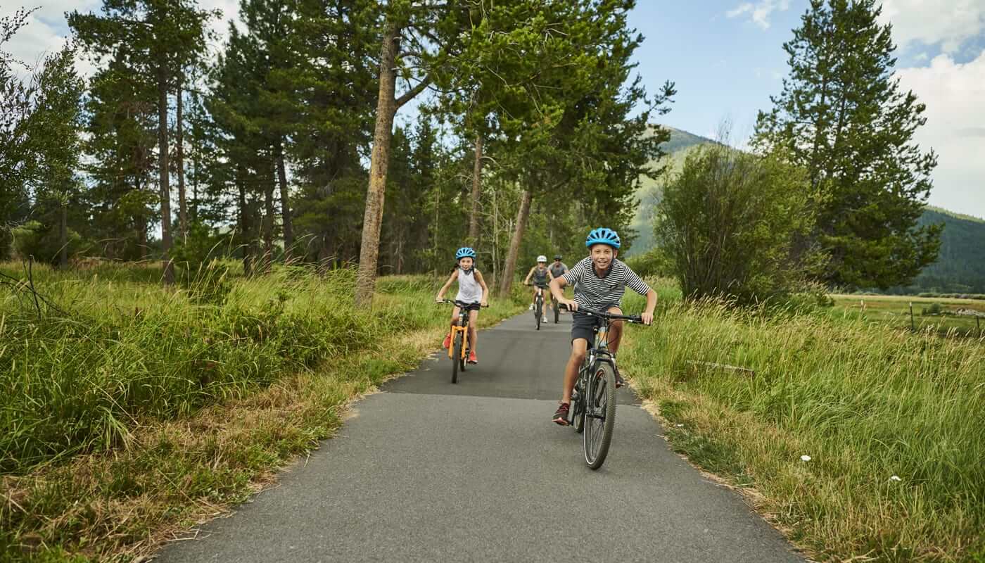 A family biking on their summer vacation in Sisters, Oregon.