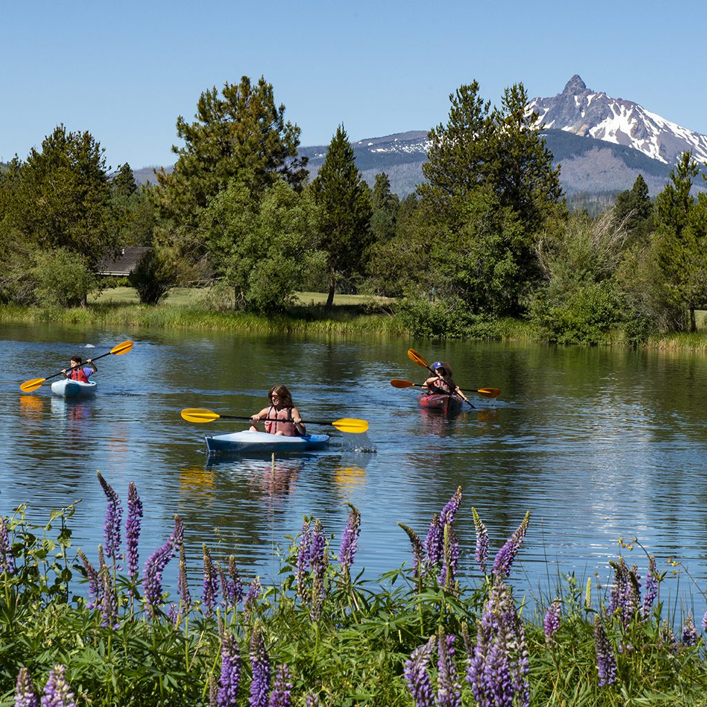 Group kayaking on the lake.