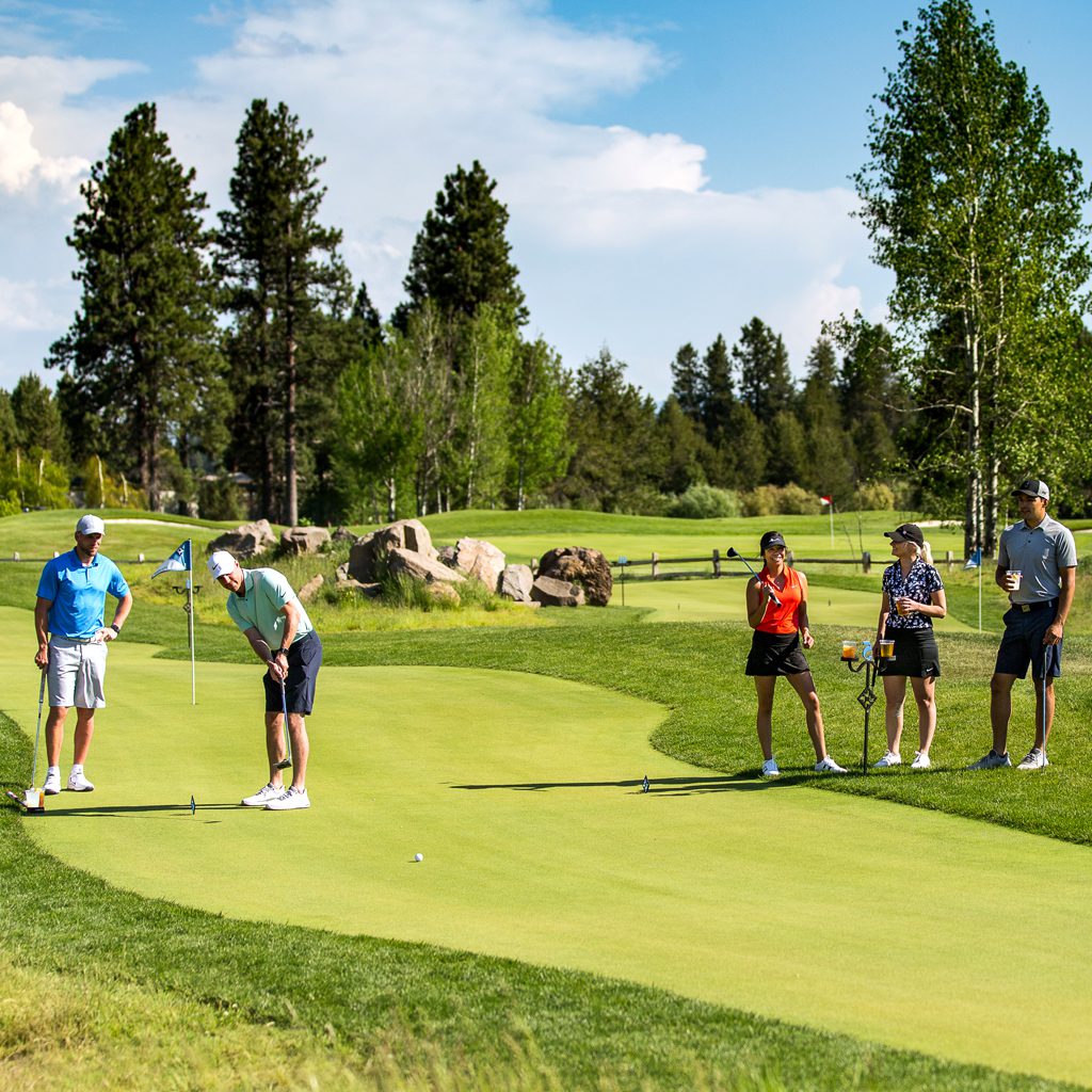 Group playing on putting course.