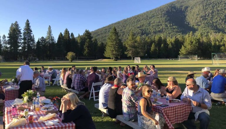 A large family sitting down for a meal, one of the top reunion ideas at BBR.