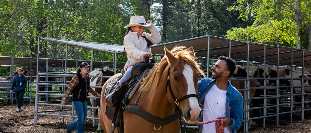 A little girl horseback riding in Oregon.