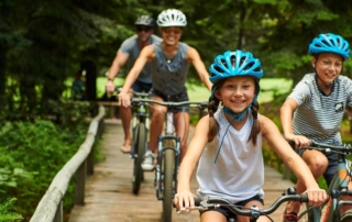 A family biking, which was an activity on their Oregon itinerary when staying at a Sisters resort.