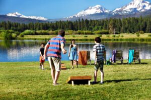 A family playing games at one of the best resorts in Sisters, Oregon.