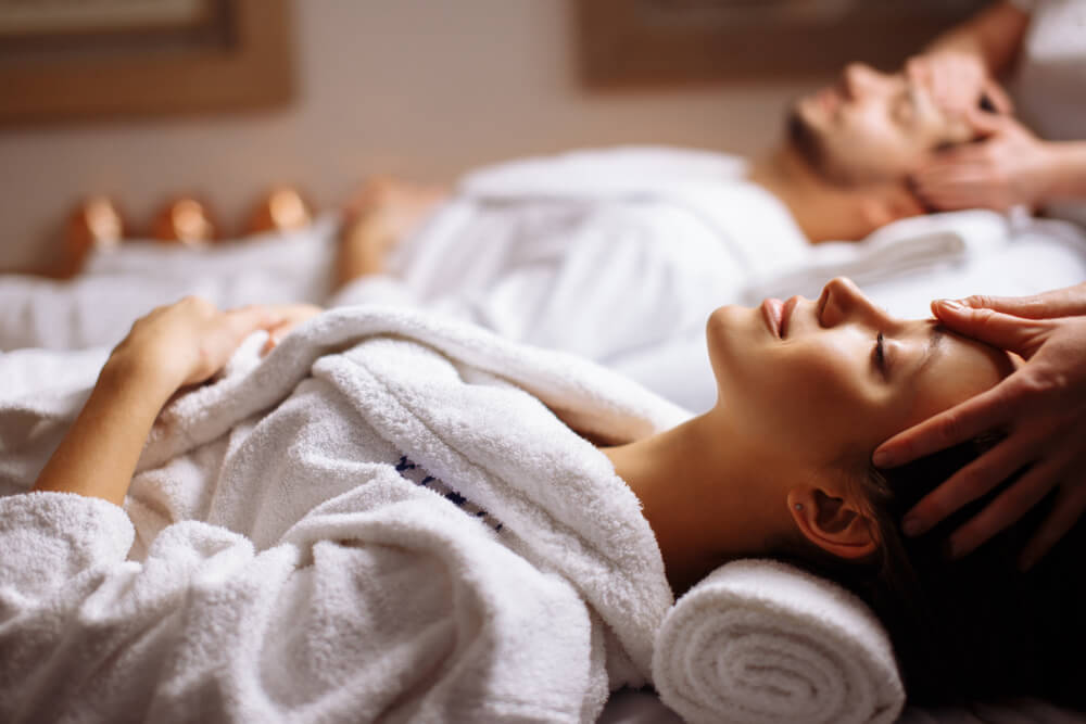 A couple getting massages on a romantic Oregon getaway.