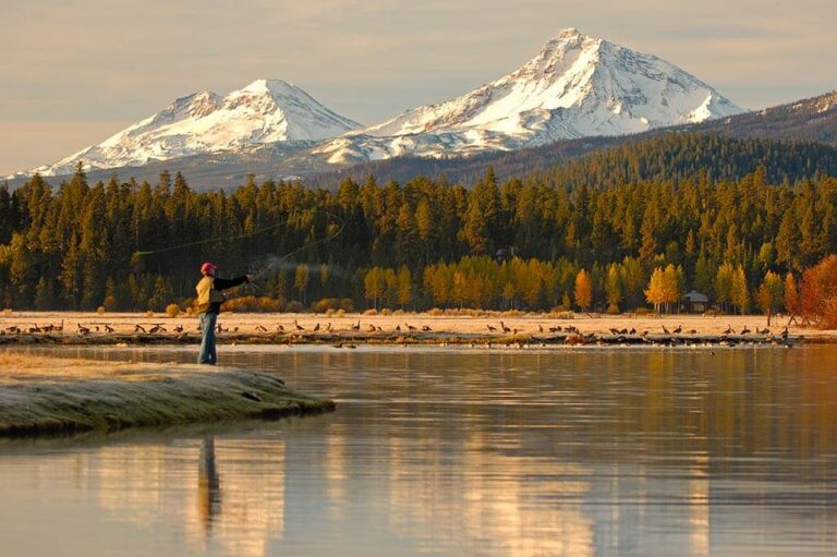A person fishing on their Bend to Sisters, Oregon, staycation.